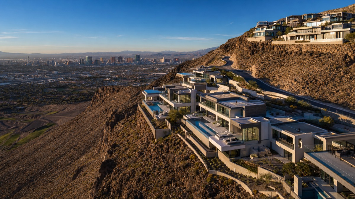 Aerial of a Henderson guard-gated luxury neighborhood near Las Vegas, where Illinois transplants trade 2% property tax for roughly 0.5%